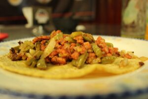 A freshly made Mexican taco served on a plate