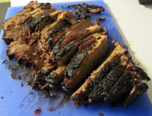 Sliced smoked beef brisket served on butcher paper, Central Texas barbecue style